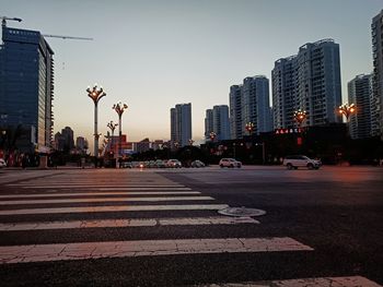 City street and buildings against sky