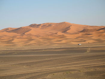 Scenic view of desert against clear sky