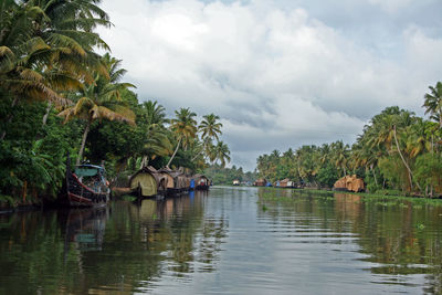 Scenic view of lake against cloudy sky