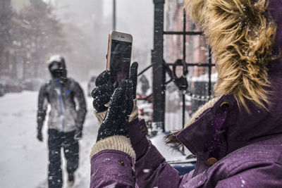 Close-up of woman photographing