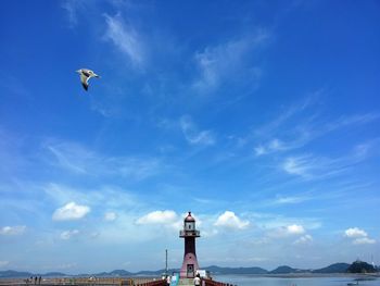 Man in sea against sky