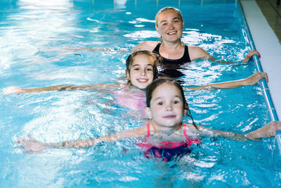 Portrait of smiling girl swimming in pool