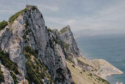 Panoramic view of sea and mountains against sky