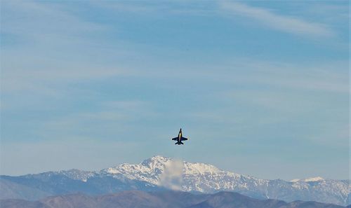 Low angle view of airplane flying in sky