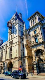Low angle view of buildings against blue sky