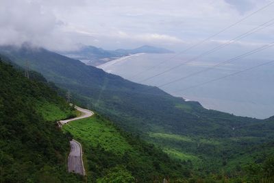 Scenic view of mountains against cloudy sky