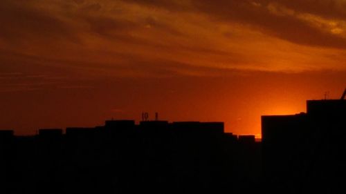 Silhouette of buildings at sunset