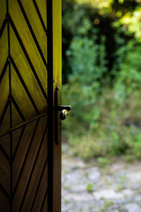 Close-up of yellow door handle