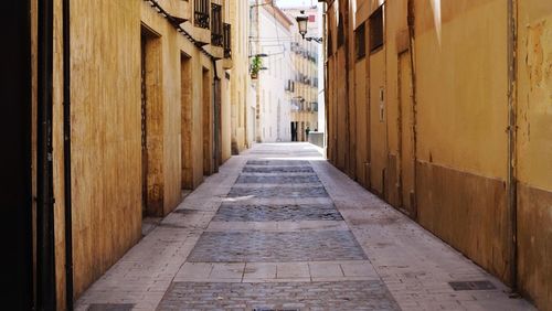 Narrow alley along buildings