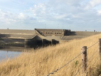 Scenic view of farm against sky