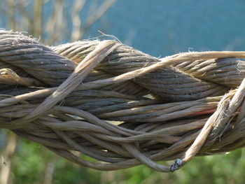 Close-up of rope tied to water