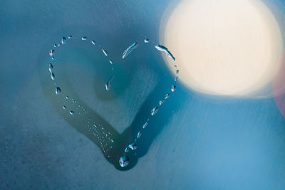 Close-up of heart shape in water