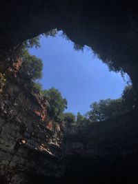 Low angle view of rock formation against sky