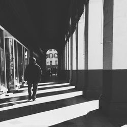 Man walking in corridor