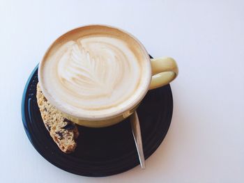 High angle view of coffee cup on table