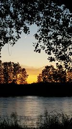 Scenic view of lake at sunset