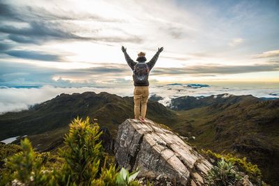 Scenic view of mountains against cloudy sky