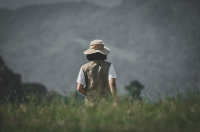 Full length of woman standing on field