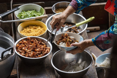 Cropped hands of man preparing food