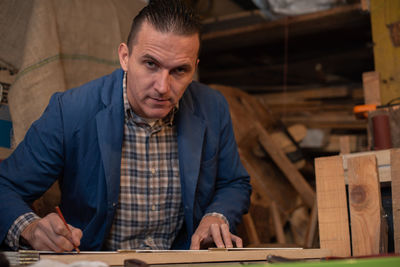 Portrait of man working on table