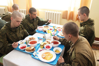 Group of people sitting on table