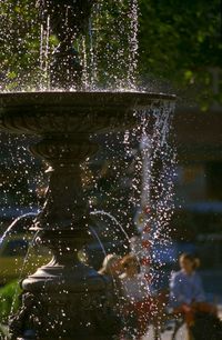 Water drops on fountain in park