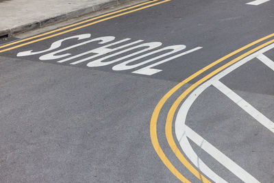 On the road near the school, the markings have been updated. yellow and white lines on the asphalt