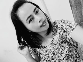 Portrait of young woman looking down