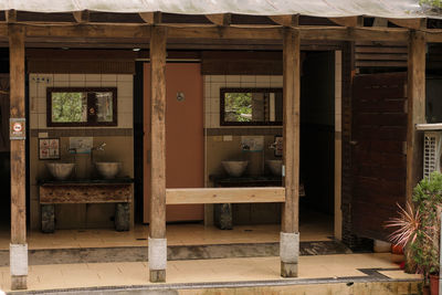 Potted plants on window of building