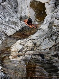 Man climbing on rock