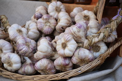 Close-up of vegetables for sale in market, garlics