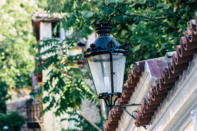 Low angle view of street light against building