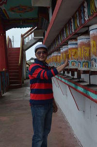 Portrait of young man standing in temple