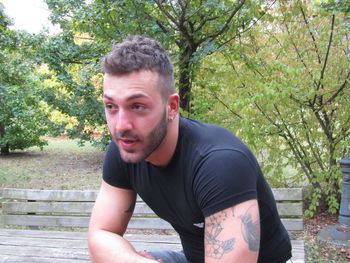 Portrait of young man in park