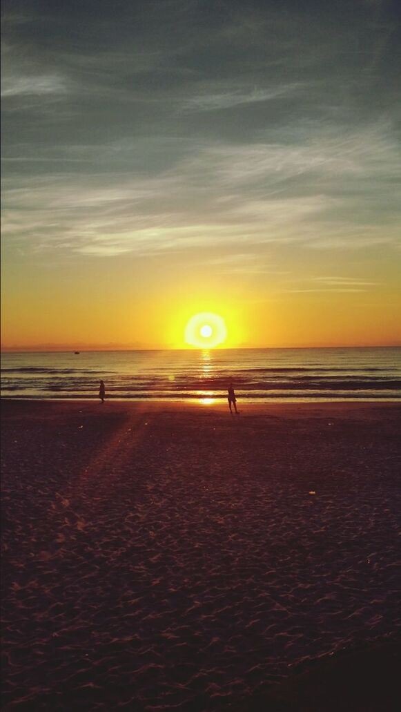 sunset, sea, horizon over water, beach, water, sky, scenics, shore, tranquil scene, beauty in nature, tranquility, orange color, sun, sand, idyllic, nature, silhouette, cloud - sky, sunlight, wave