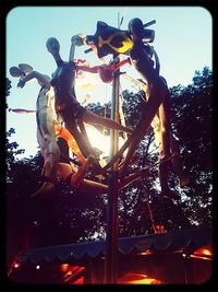 Low angle view of illuminated ferris wheel