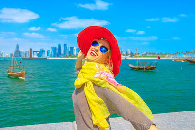 Smiling woman at beach in city