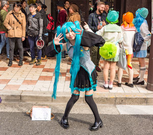 People standing on street in city