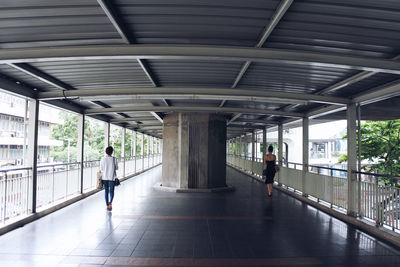 People walking on bridge