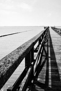 Pier over sea against sky