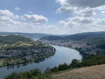 High angle view of river by cityscape against sky