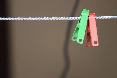 Close-up of clothespins on rope