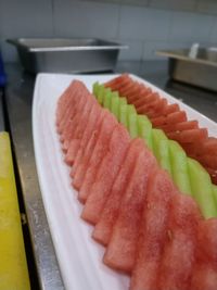 High angle view of chopped vegetables in plate on table