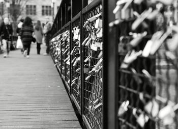 Man walking on footbridge in city