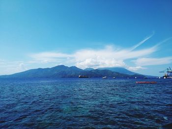 Scenic view of sea against blue sky