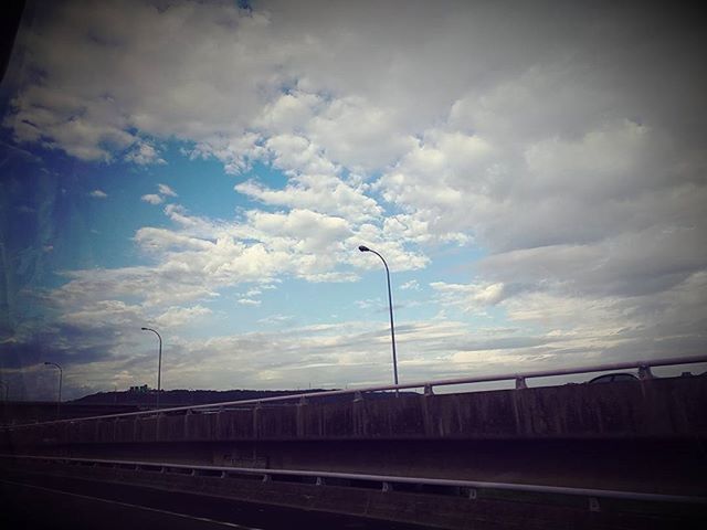 sky, street light, cloud - sky, cloudy, road, transportation, the way forward, lighting equipment, cloud, power line, electricity pylon, electricity, dusk, railroad track, connection, street, diminishing perspective, overcast, built structure, outdoors