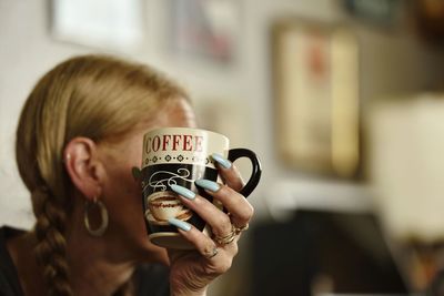 Portrait of woman photographing
