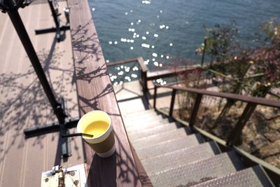 High angle view of staircase by sea