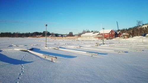 View of built structures against clear blue sky