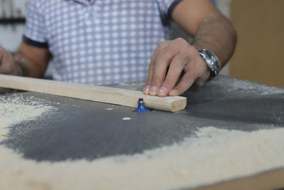 Close-up of woman working on table